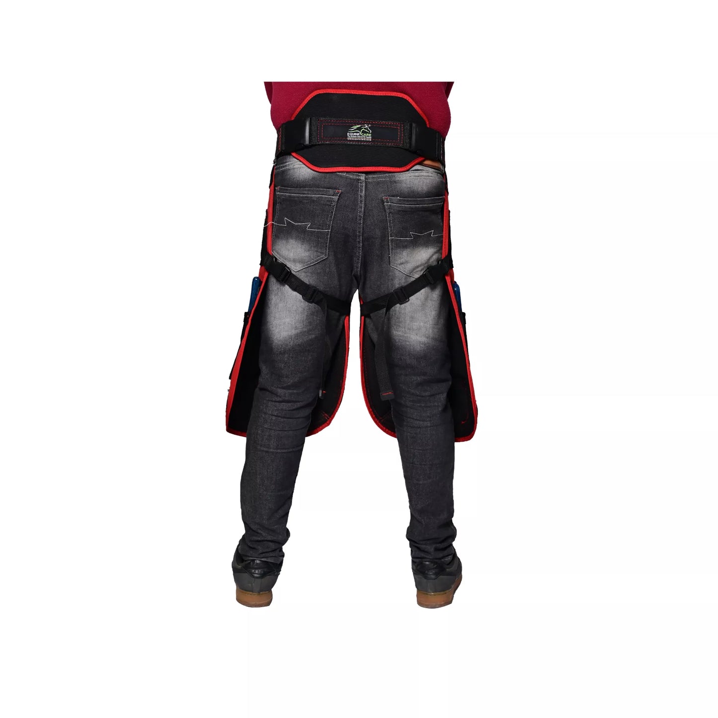 Rear view of Crimson Shield Farrier Apron worn by a farrier, showing adjustable back support belt, secure leg straps, and red-trimmed thigh protection for professional horse shoeing work