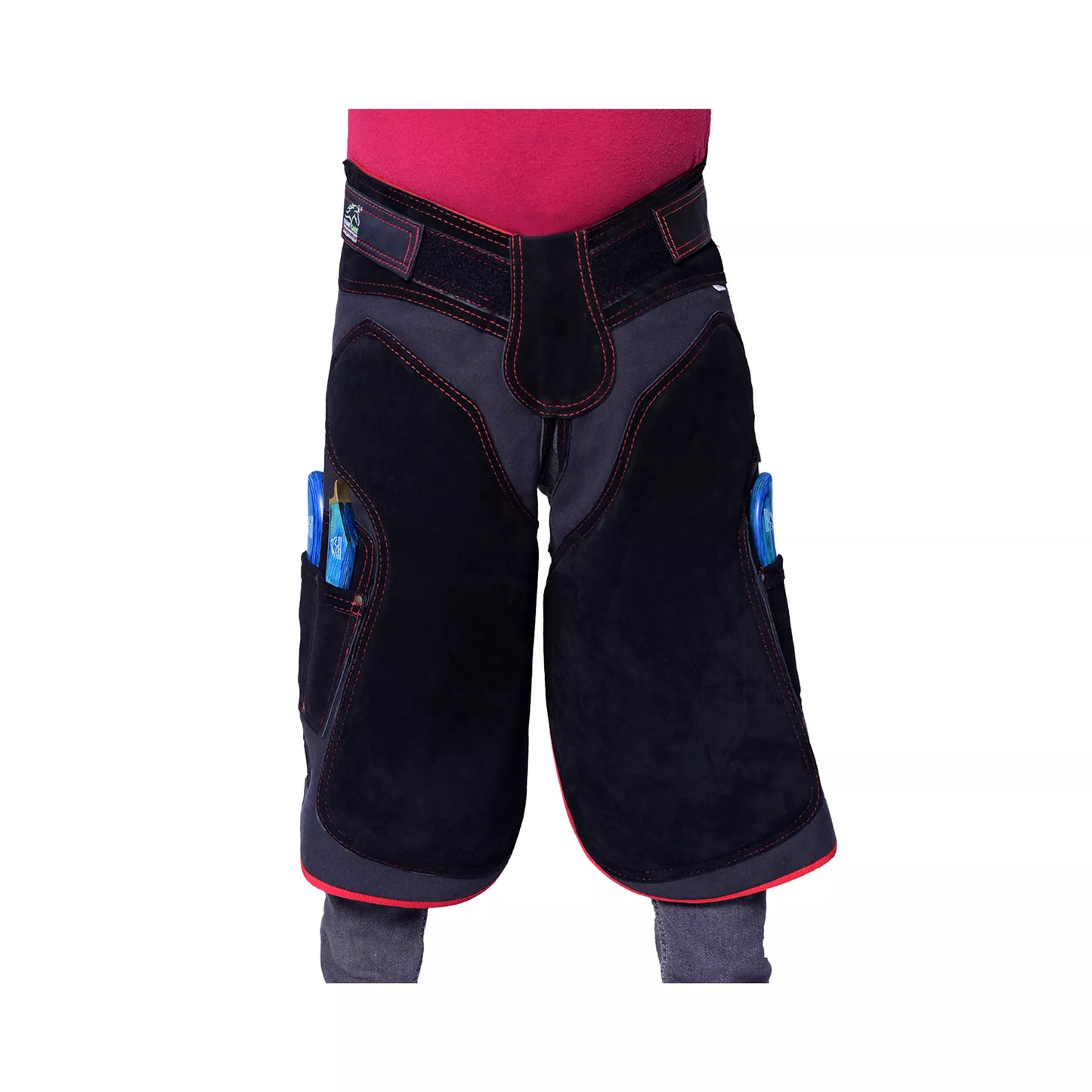 Front view of black farrier chaps featuring red contrast stitching, reinforced thigh protection, and side tool pockets, designed for professional horse shoeing and hoof care work