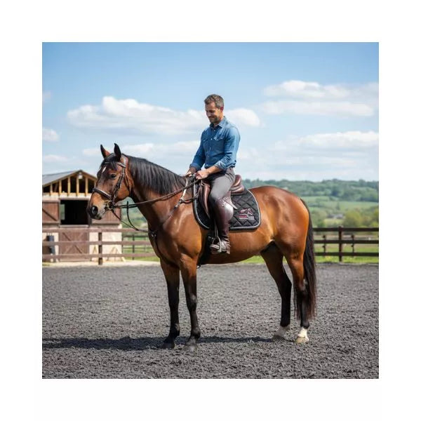 Detailed view of Equine Care logo and diamond quilted English saddle pad with shock absorbing padding