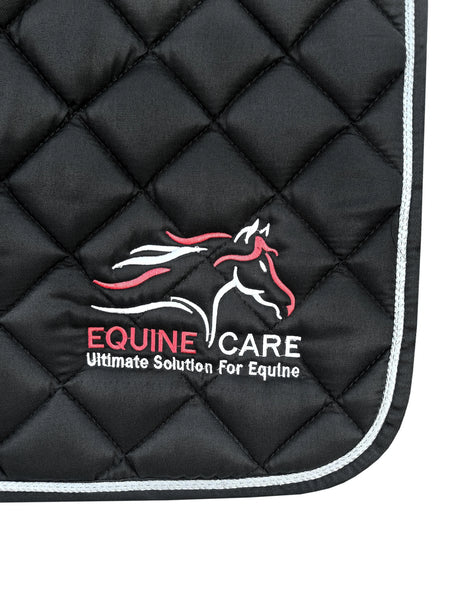 Equine Care logo stitched on black shock-absorbing English saddle pad