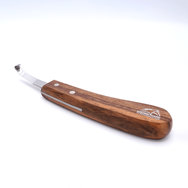 Angled view of Equine Care short blade farrier hoof knife featuring a J2 stainless steel blade and ergonomic pure wooden handle for precise hoof trimming