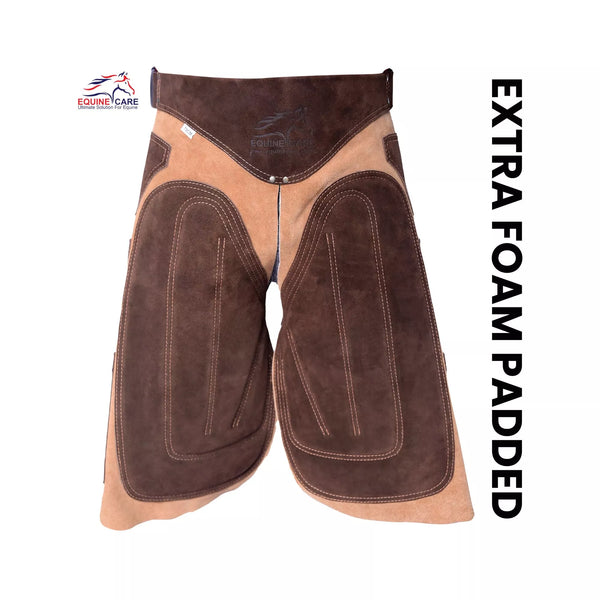 Premium beige suede leather farrier apron with EVA foam padding and canvas panels Front view of brown suede leather farrier chaps with extra foam padded thigh panels and reinforced stitching, designed for superior comfort and protection during professional horse shoeing work