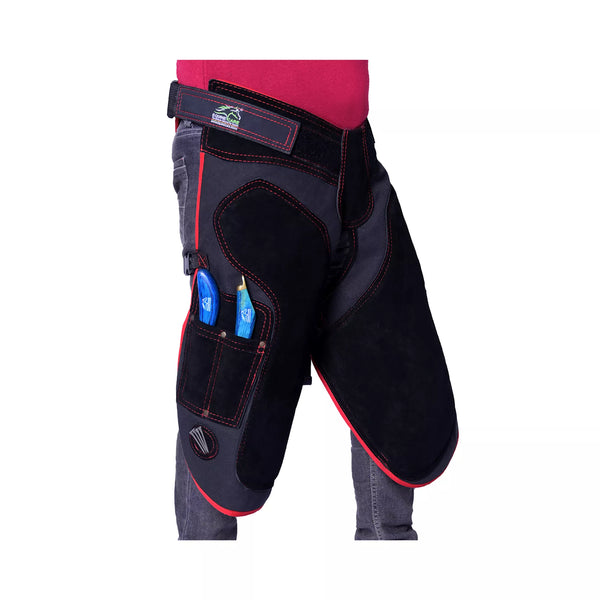 Equine Care Pro Artisan Farrier Apron - Side view of black farrier chaps featuring red contrast stitching, reinforced thigh padding, adjustable waist belt, and integrated tool pockets for professional horse shoeing and farrier work